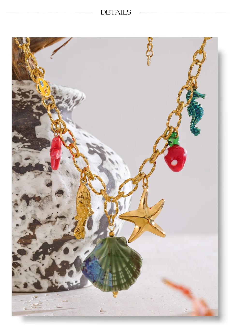 Shell enamel star necklace in gold-plated stainless steel with shell and enamel.