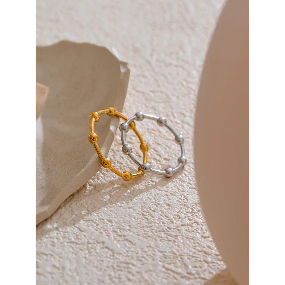 Beaded minimalist geometric ring in 18K gold-plated stainless steel.