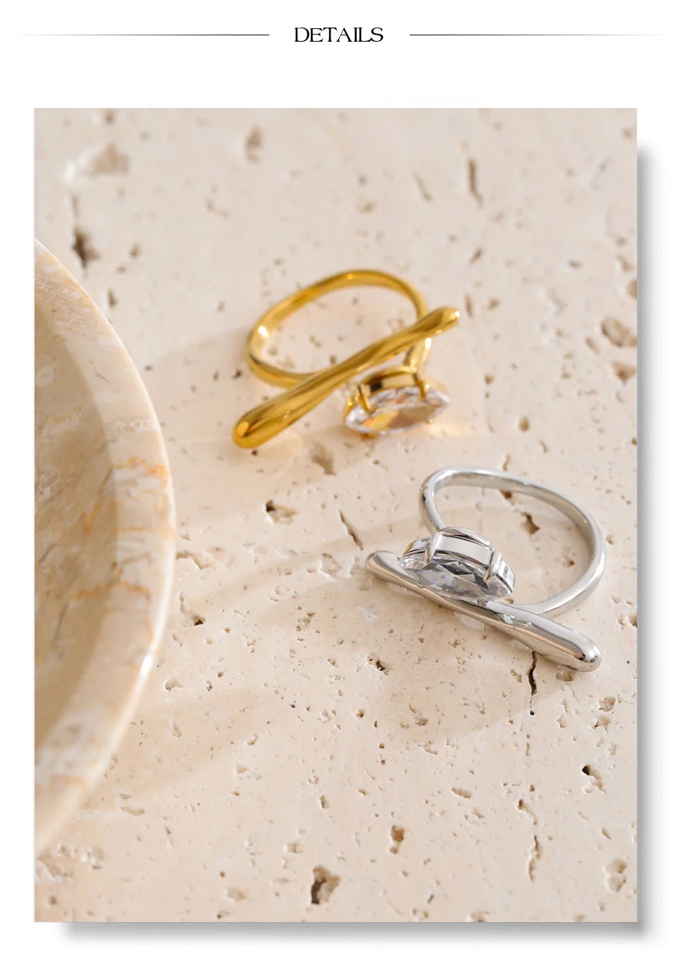 Cubic zirconia geometric ring in 18K gold-plated stainless steel with cubic zirconia.