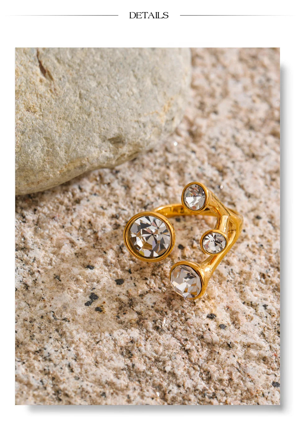 Crystal geometric ring in 18K gold-plated stainless steel with crystal.