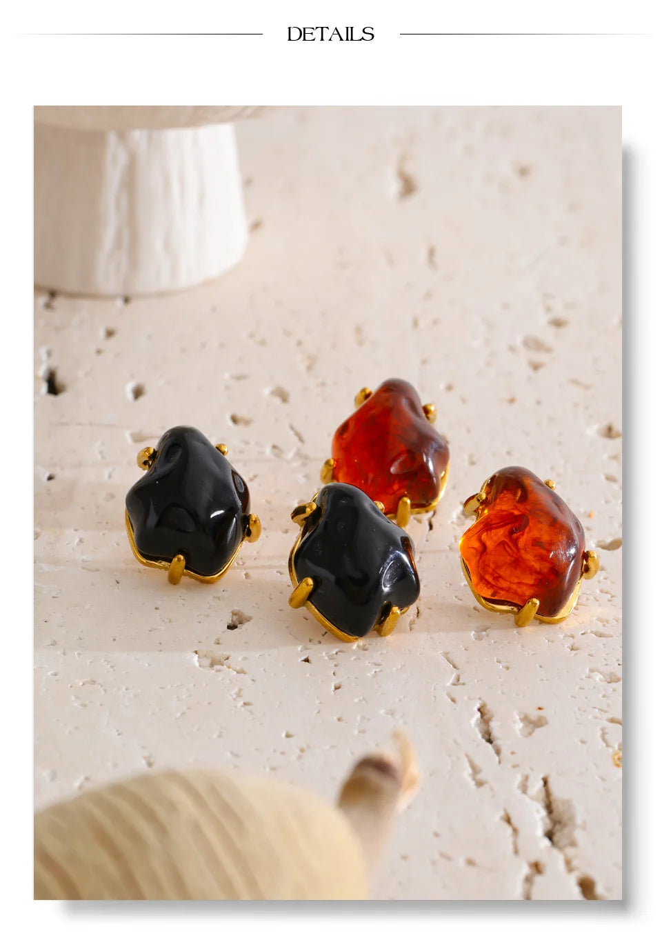 Black resin acrylic earrings in gold-plated stainless steel with resin and acrylic.