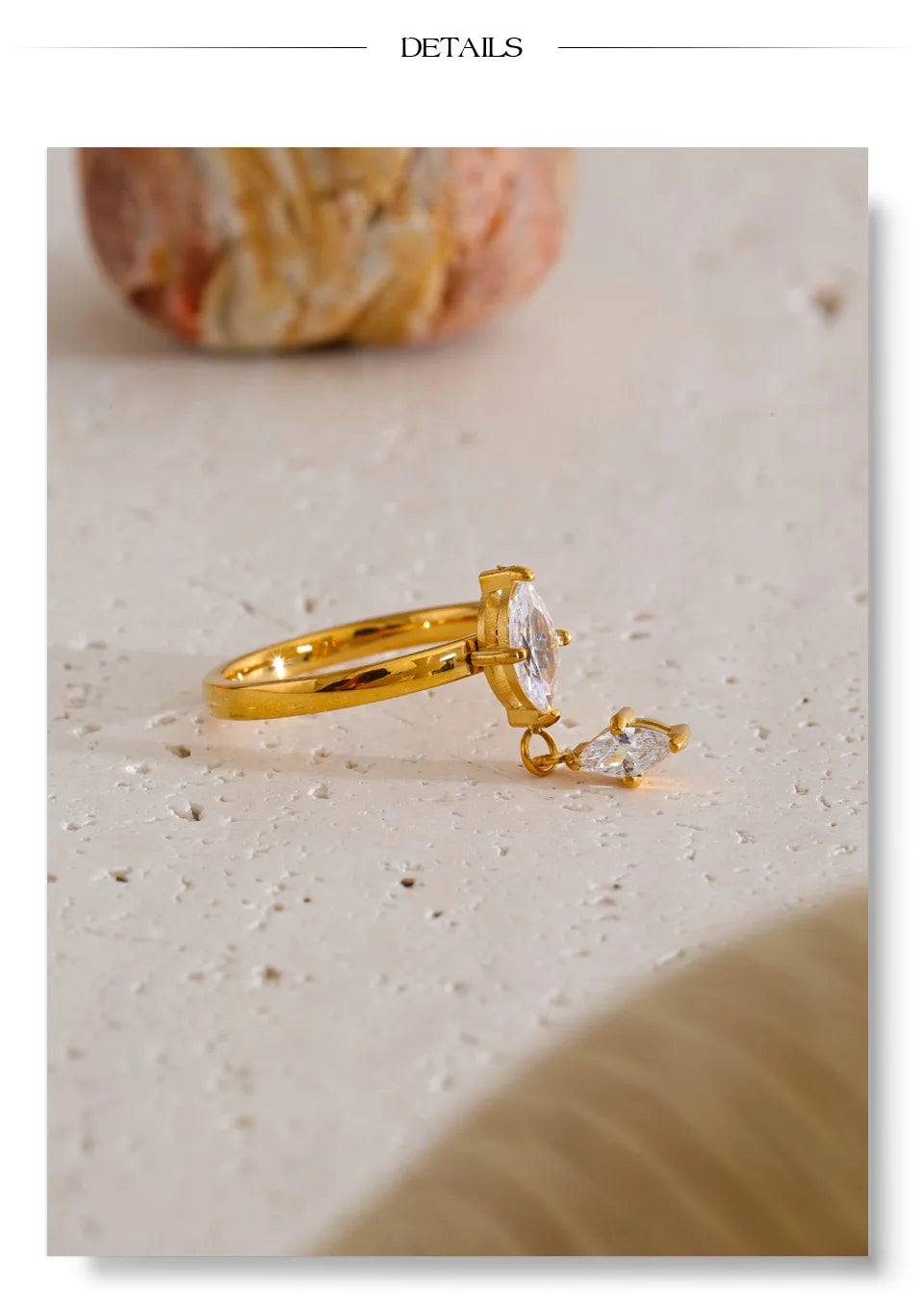 Cubic zirconia geometric ring in 18K gold-plated stainless steel with cubic zirconia.