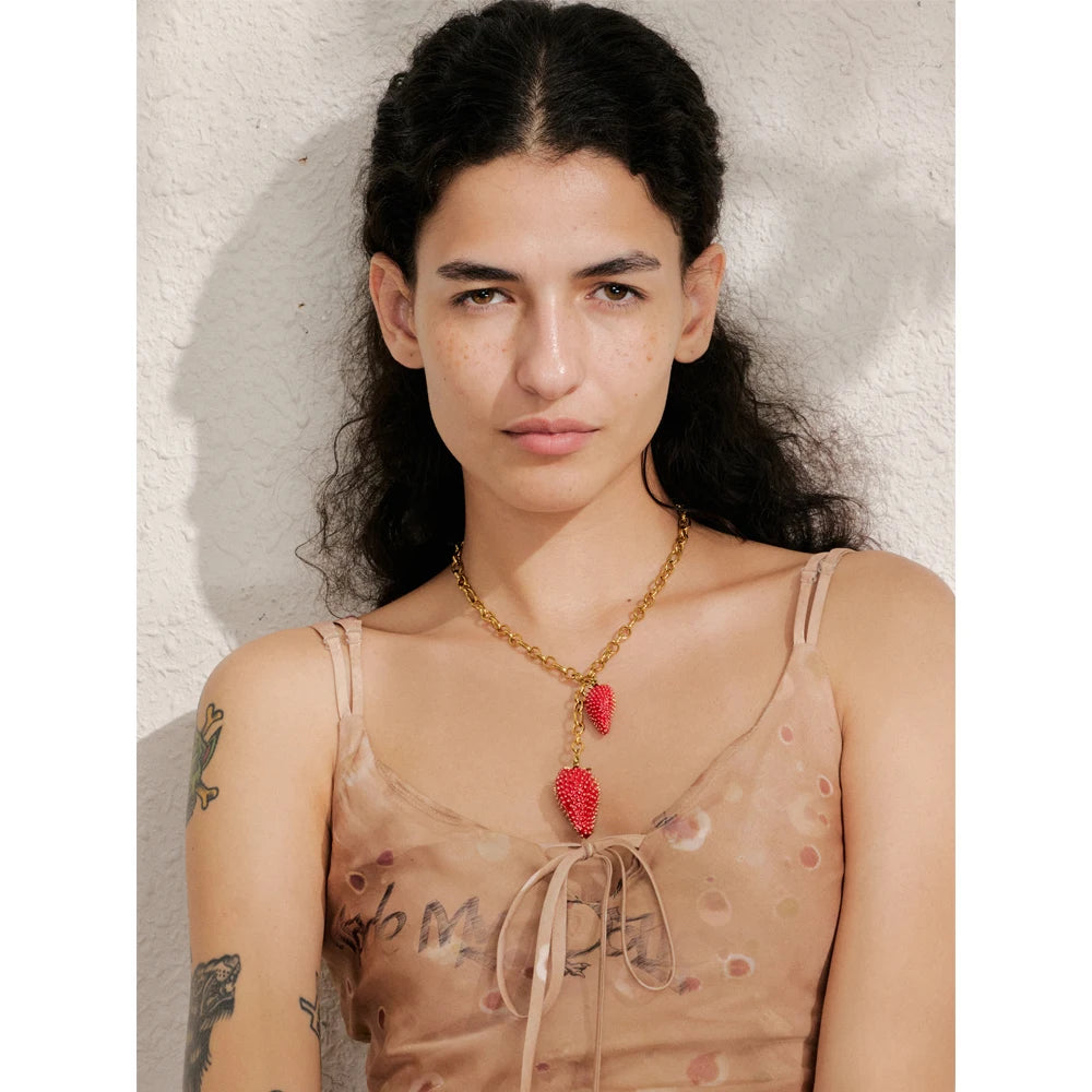 Red heart geometric necklace in gold-plated stainless steel.