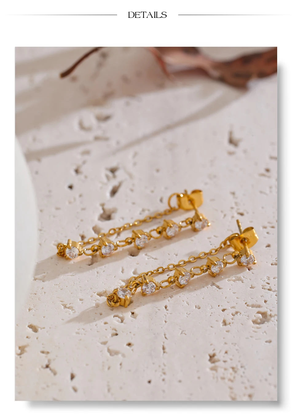 White cubic zirconia geometric earrings in gold-plated stainless steel with cubic zirconia.