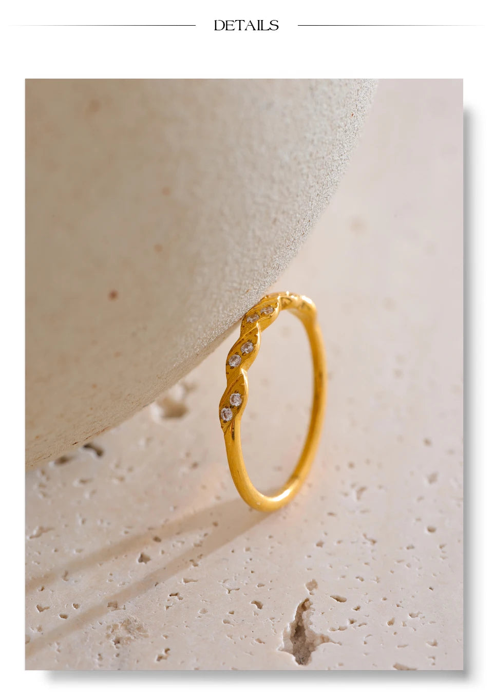 Cubic zirconia geometric ring in gold-plated stainless steel with cubic zirconia.