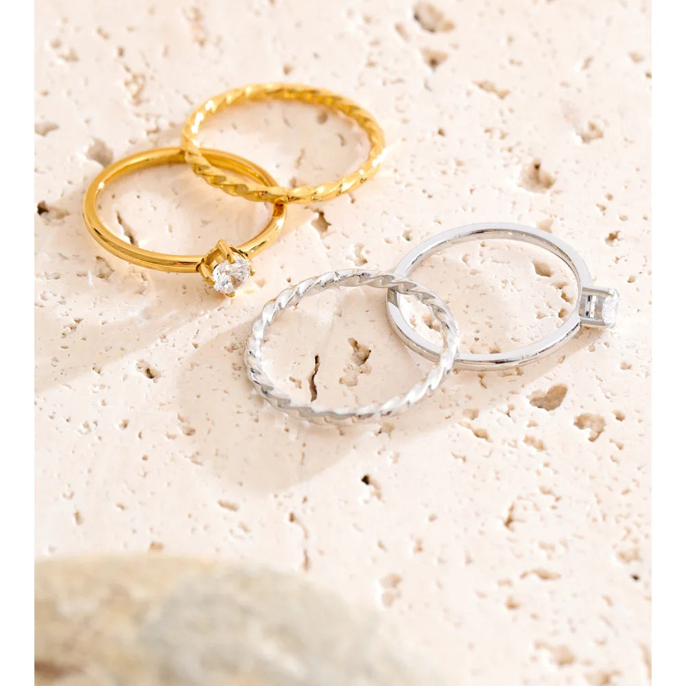 Cubic zirconia geometric ring in gold-plated stainless steel with cubic zirconia.