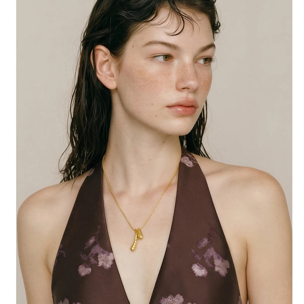 Geometric necklace in gold-plated stainless steel.