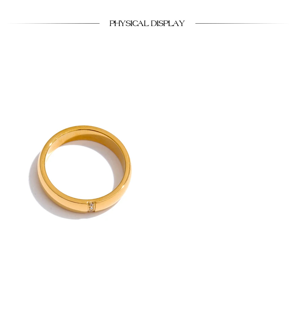 Cubic zirconia geometric ring in 18K gold-plated stainless steel with cubic zirconia.