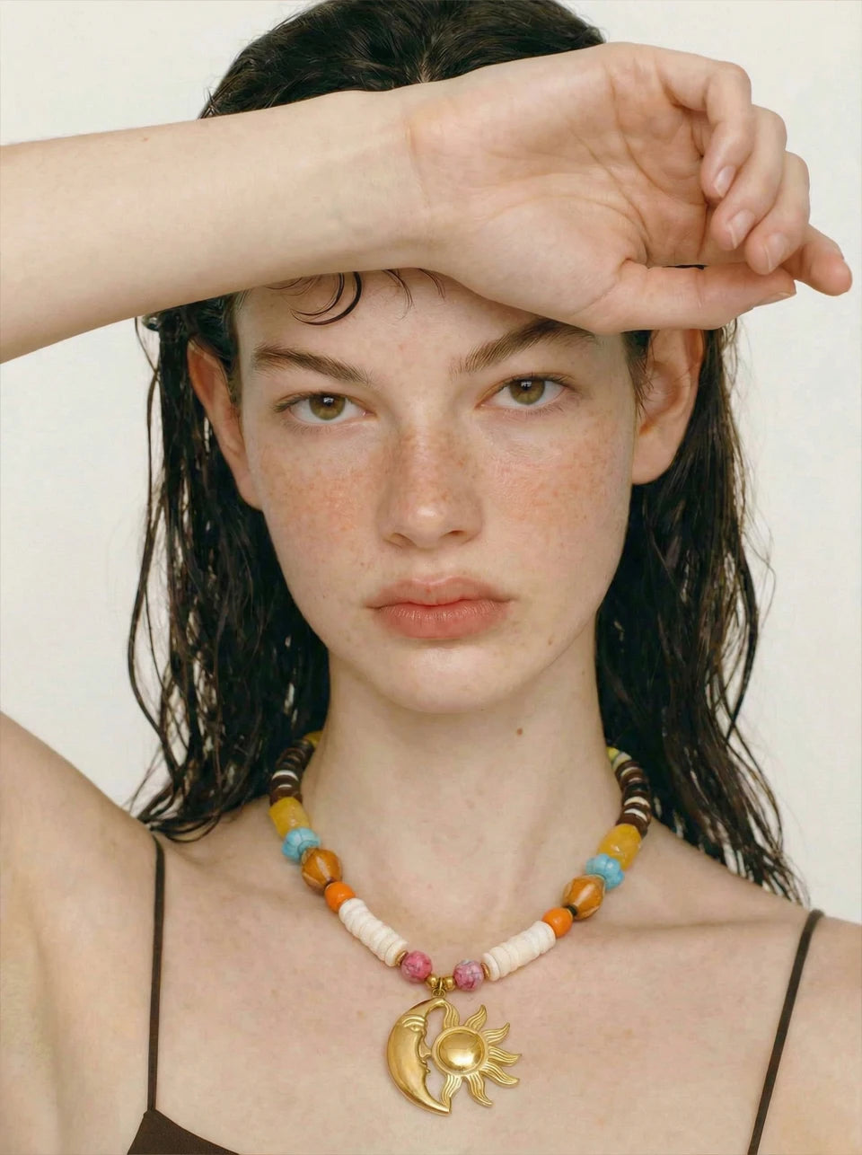 Resin natural stone moon necklace in gold-plated stainless steel with natural stone and resin.