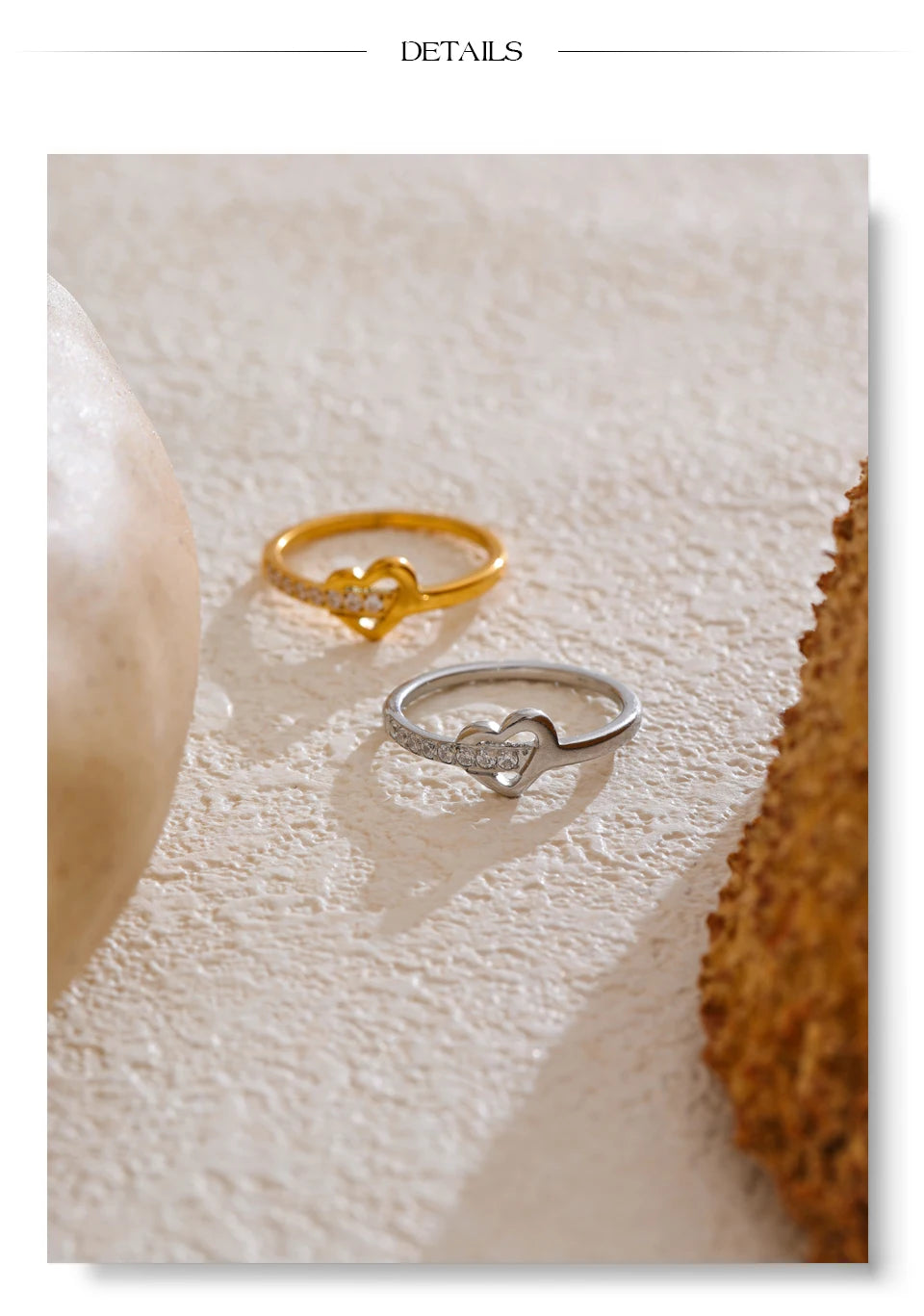Cubic zirconia heart cross ring in 18K gold-plated stainless steel with cubic zirconia.