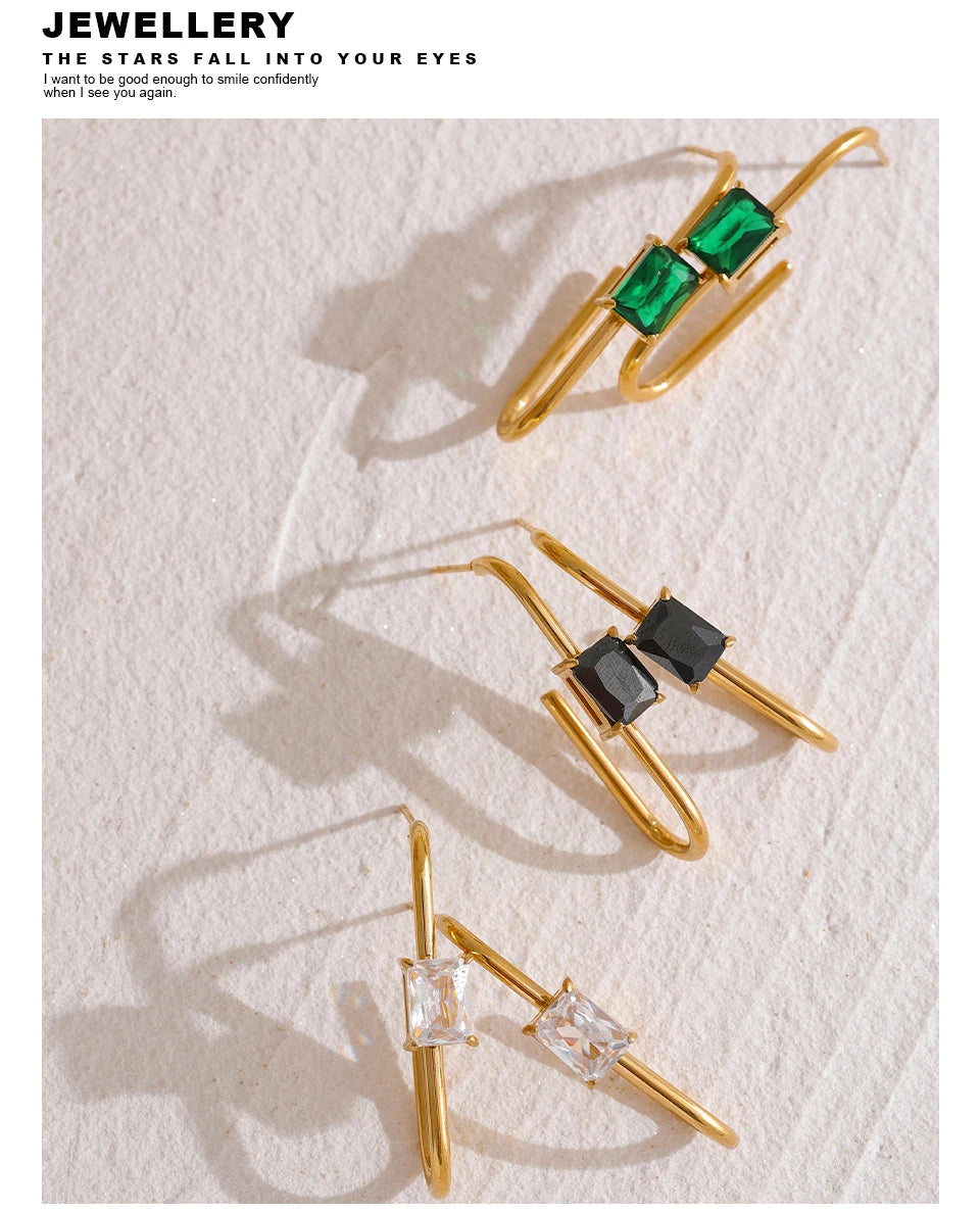 Black cubic zirconia geometric earrings in 18K gold-plated stainless steel with cubic zirconia.