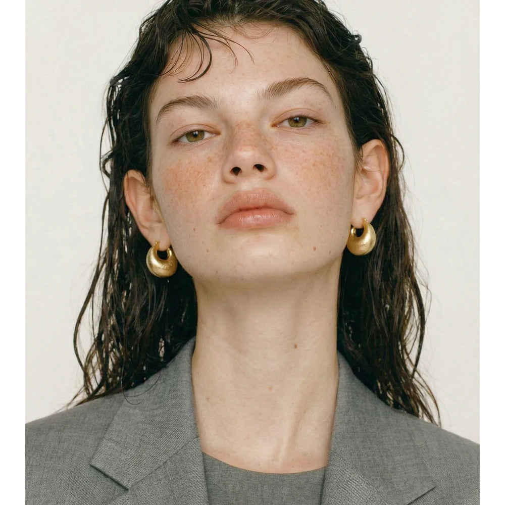 Geometric earrings in gold-plated stainless steel.