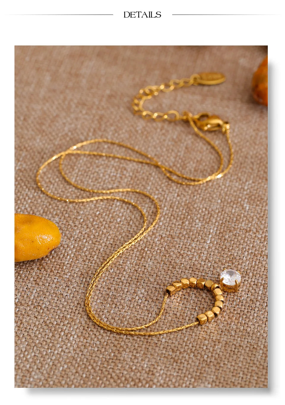 Cubic zirconia beaded geometric necklace in gold-plated stainless steel with cubic zirconia.
