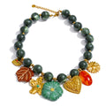 Green resin acrylic necklace in gold-plated stainless steel with resin and acrylic.