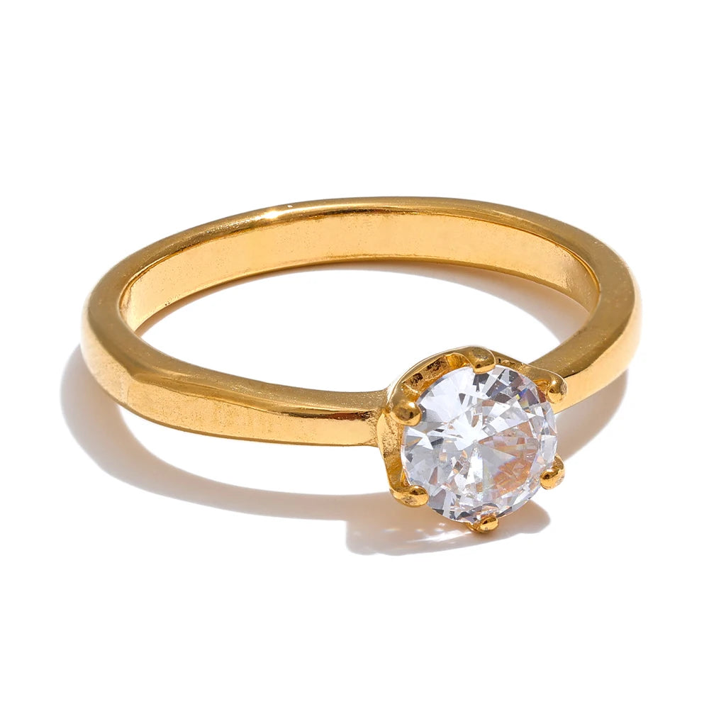 Cubic zirconia geometric ring in 18K gold-plated stainless steel with cubic zirconia.