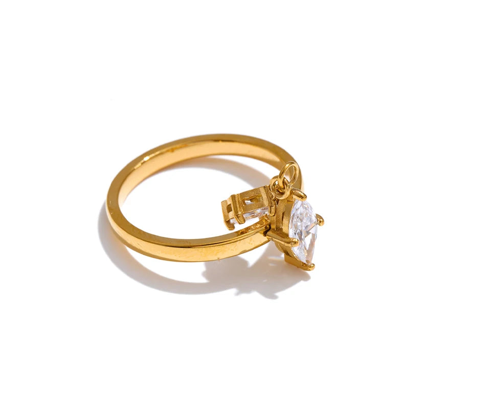 Cubic zirconia geometric ring in 18K gold-plated stainless steel with cubic zirconia.