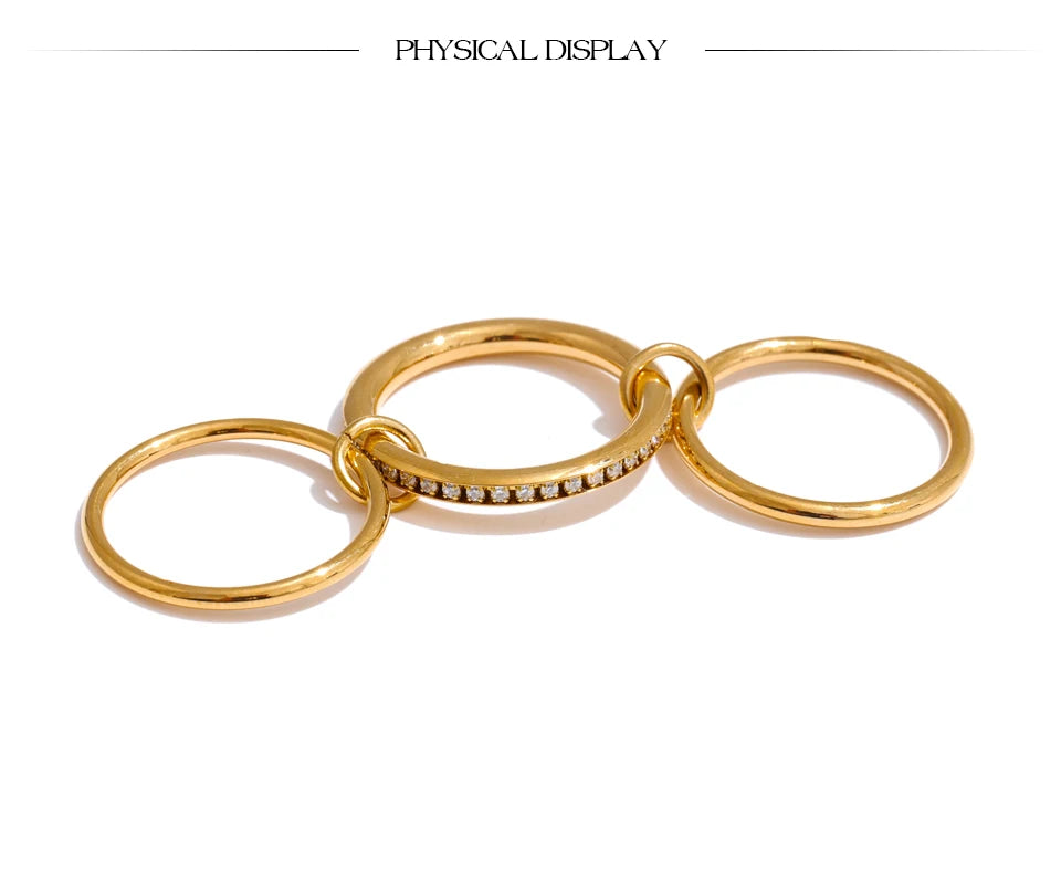 Cubic zirconia geometric layered ring in 18K gold-plated stainless steel with cubic zirconia.