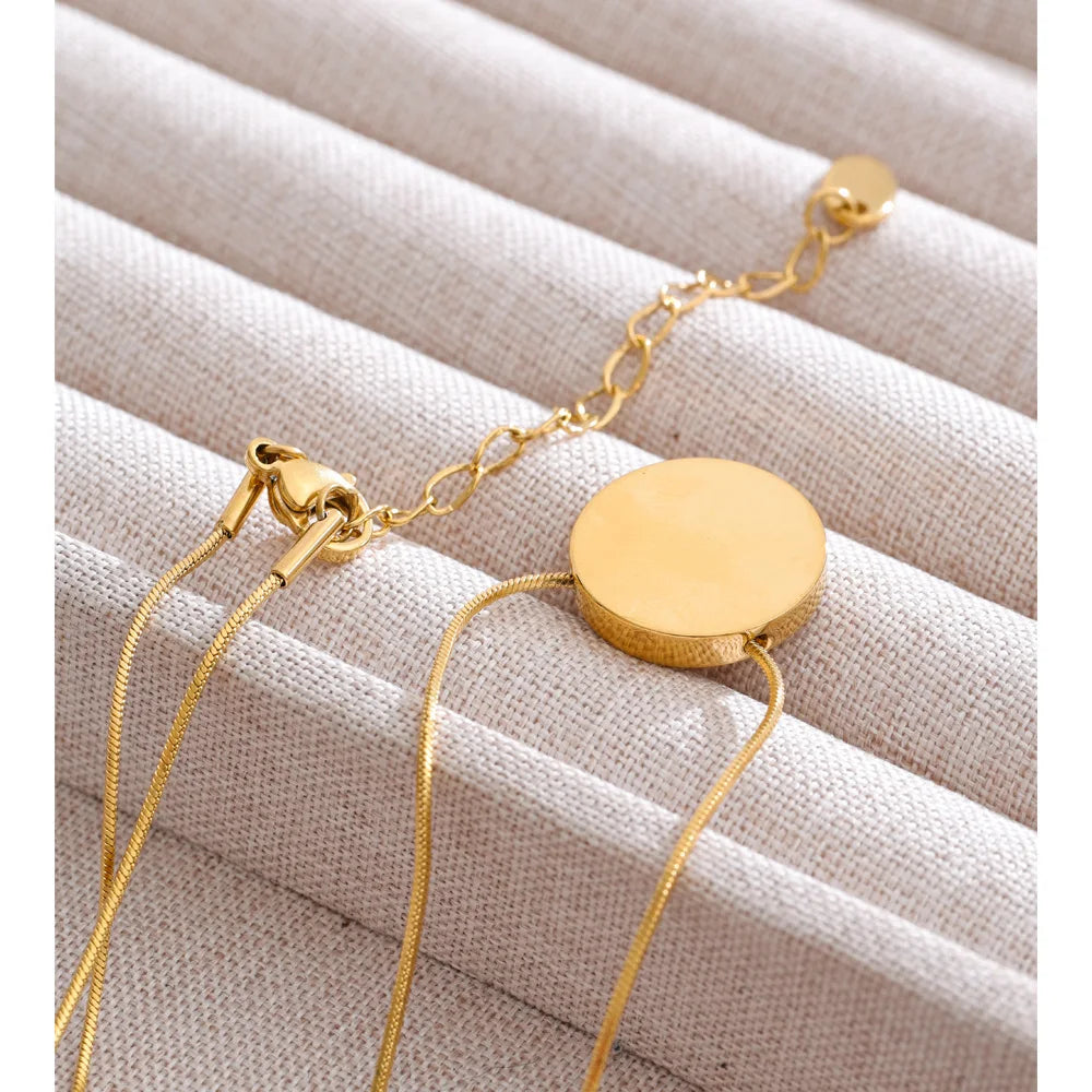 Coin geometric necklace in gold-plated stainless steel.