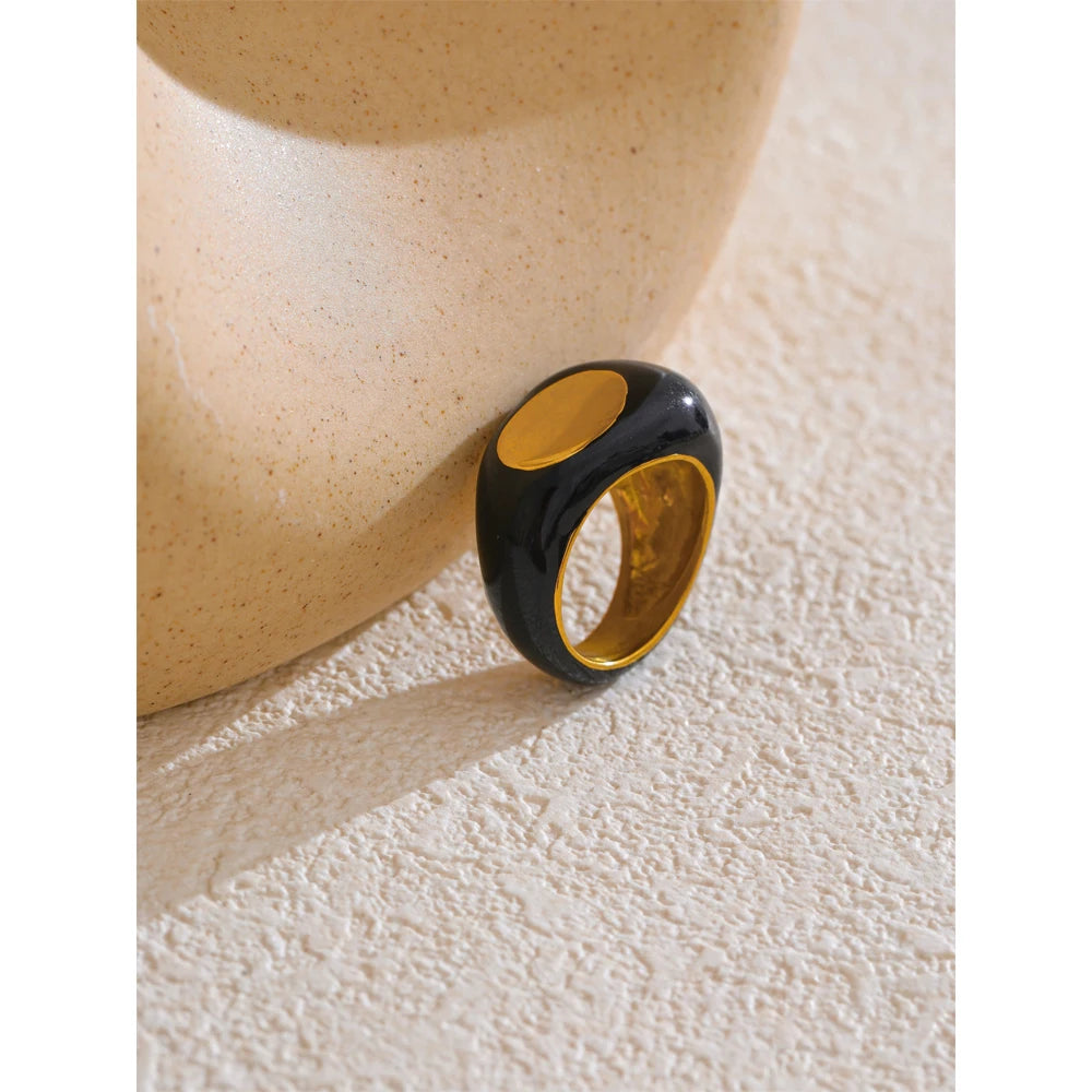 Black enamel geometric ring in gold-plated 316L stainless steel with enamel.