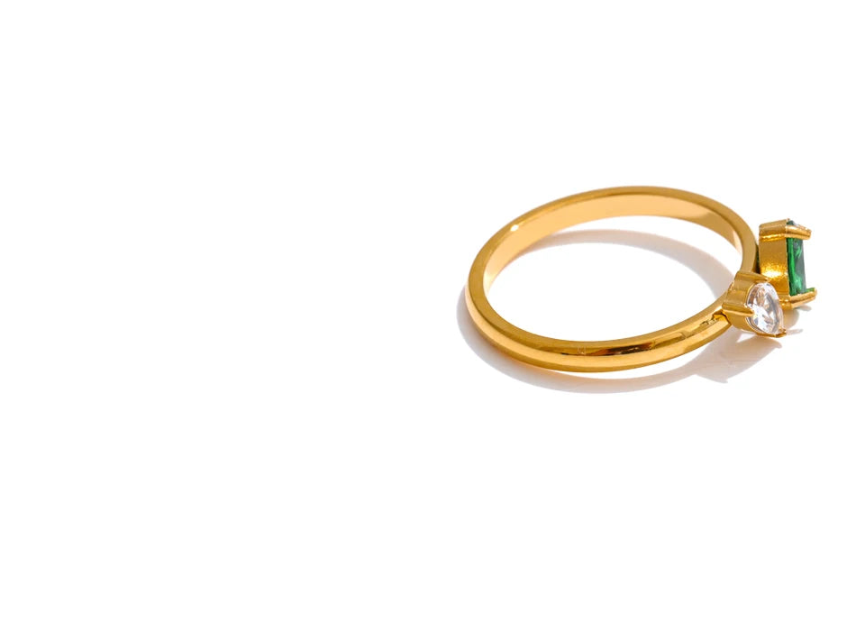 Cubic zirconia geometric ring in 18K gold-plated stainless steel with cubic zirconia.