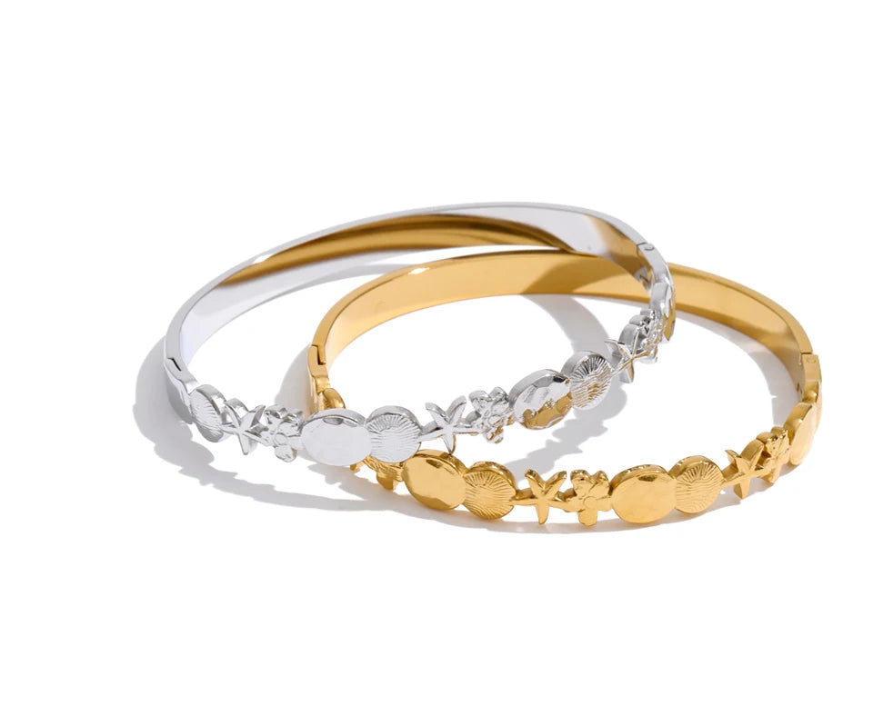 Flower star geometric bracelet in gold-plated stainless steel.
