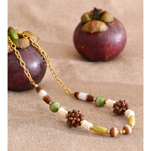 Beaded geometric chain necklace in gold-plated stainless steel.