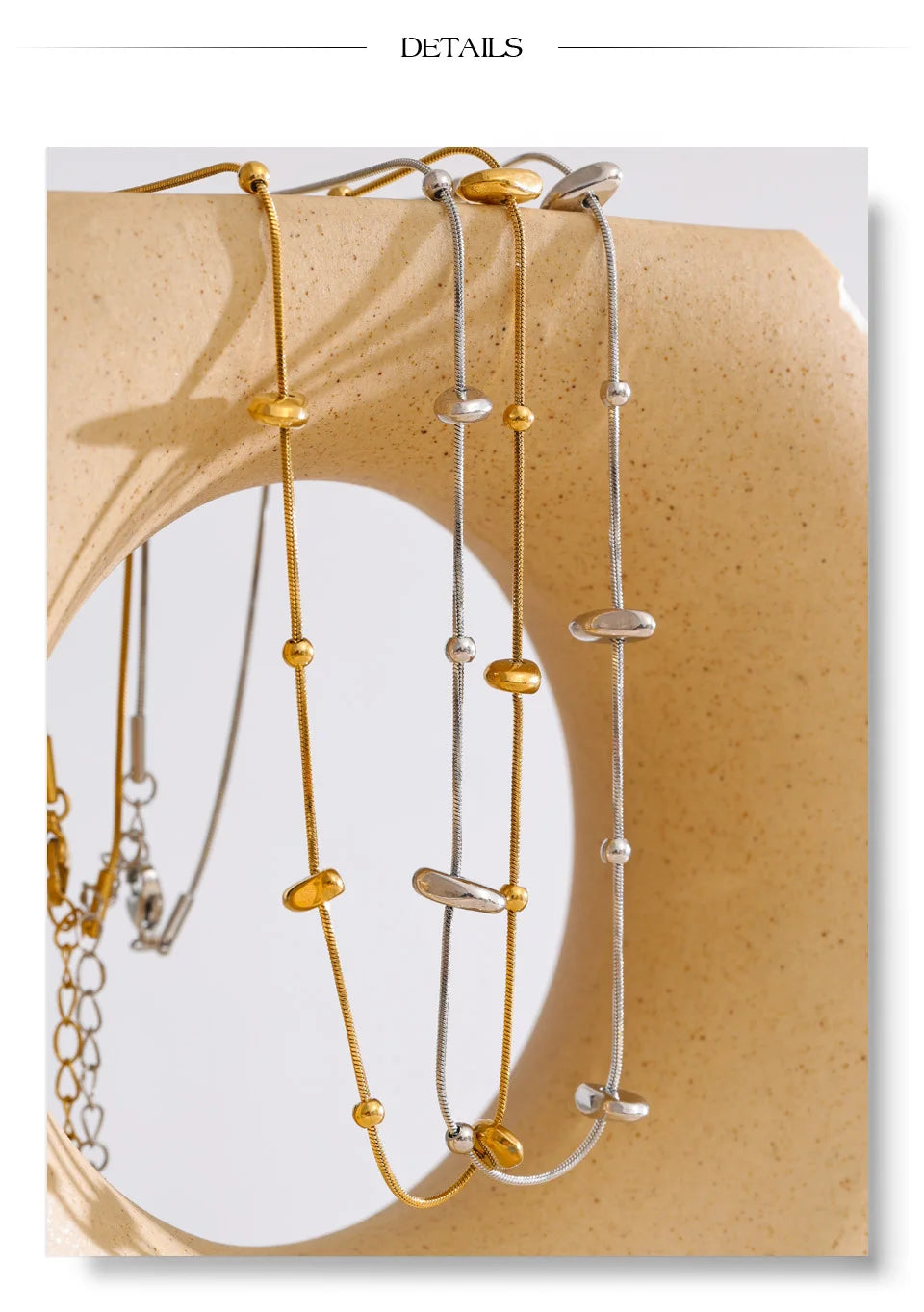 Geometric chain necklace in gold-plated stainless steel.