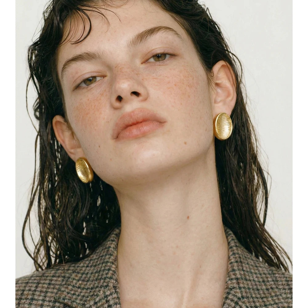 Geometric earrings in gold-plated stainless steel.