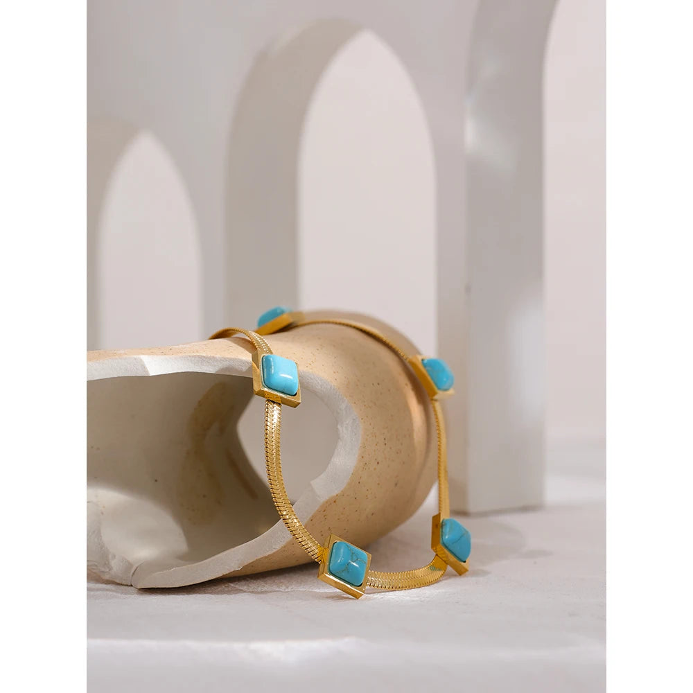 Blue natural stone snake necklace in gold-plated stainless steel with natural stone.