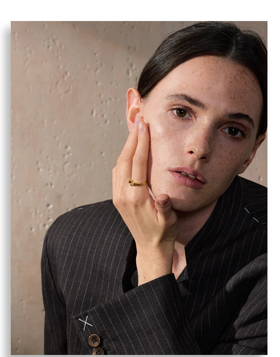 Cubic zirconia geometric ring in gold-plated stainless steel with cubic zirconia.