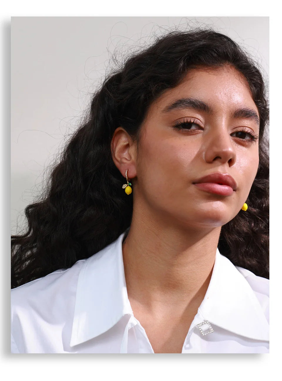 Cubic zirconia resin geometric earrings in gold-plated stainless steel with cubic zirconia and resin.