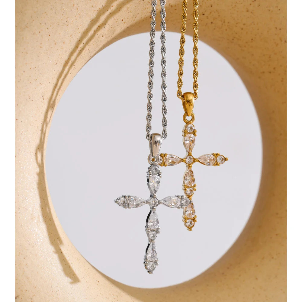 Cubic zirconia cross necklace in gold-plated stainless steel with cubic zirconia.
