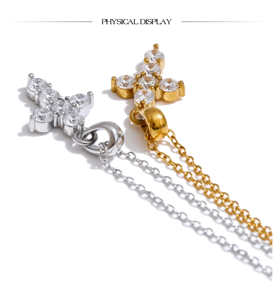 Cubic zirconia cross necklace in gold-plated stainless steel with cubic zirconia.
