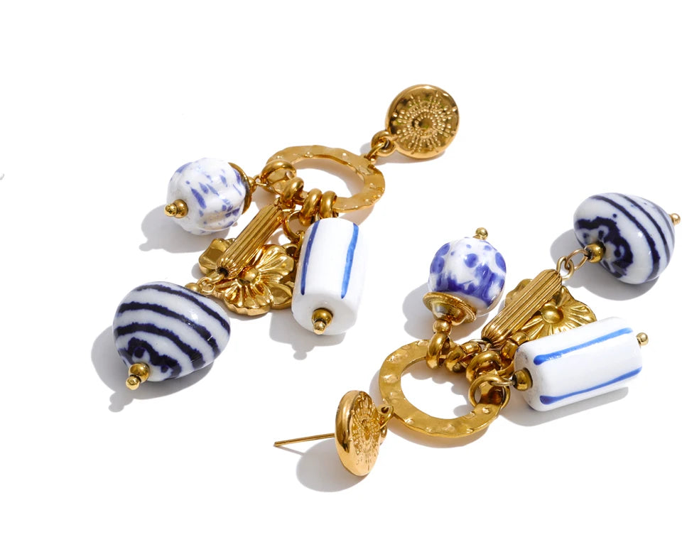 Blue heart flower earrings in gold-plated stainless steel.