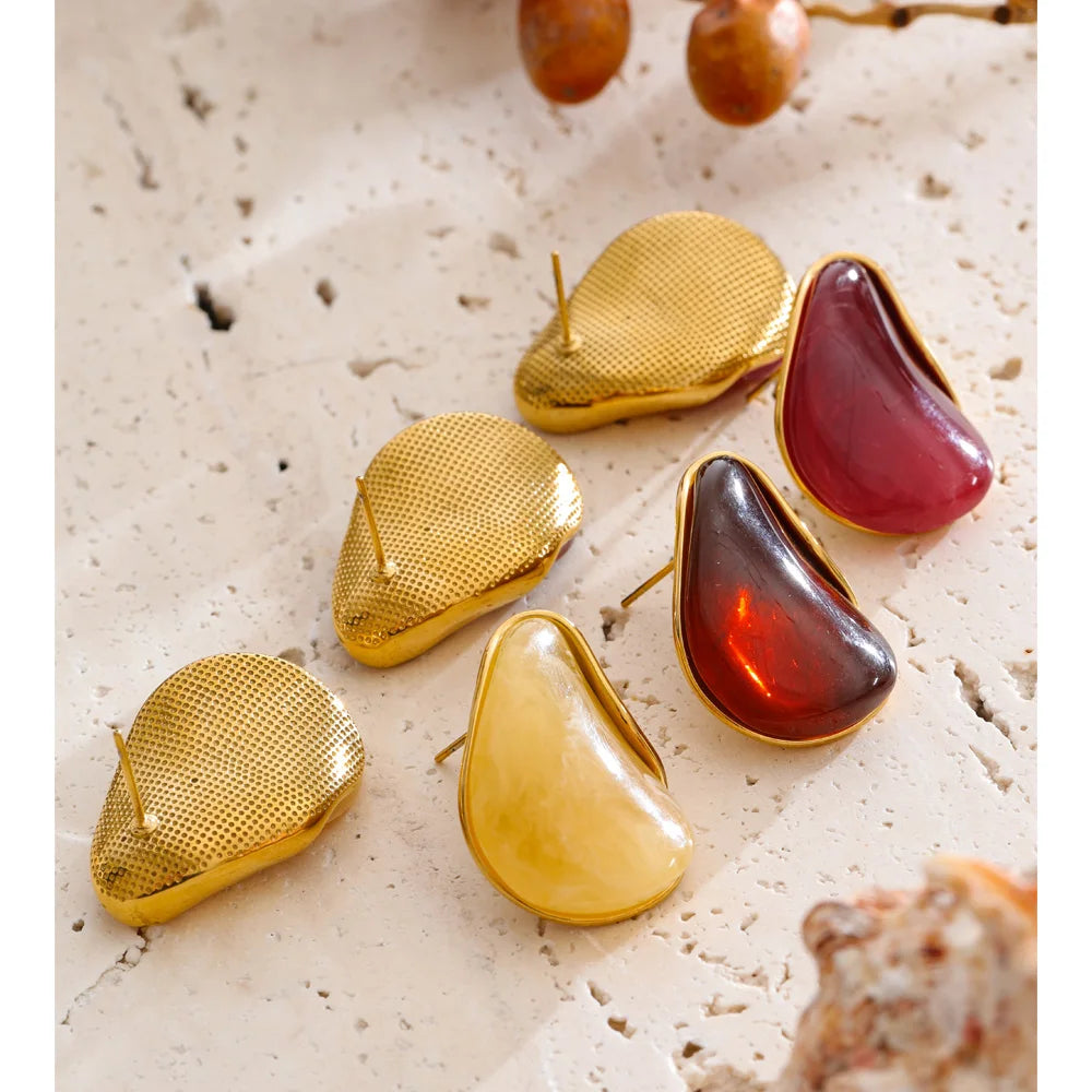 Red resin acrylic earrings in gold-plated stainless steel with resin and acrylic.