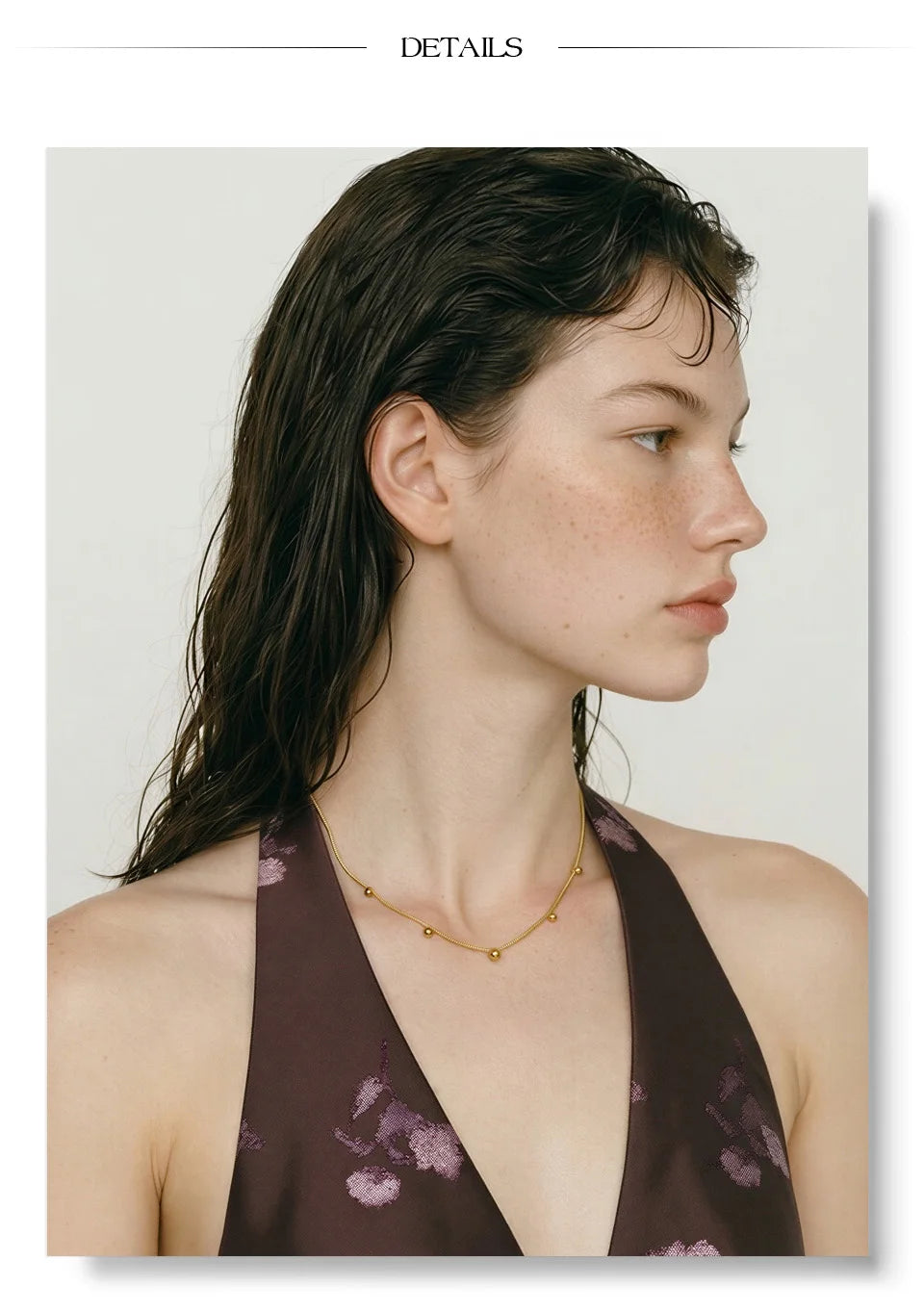 Beaded geometric chain necklace in gold-plated stainless steel.
