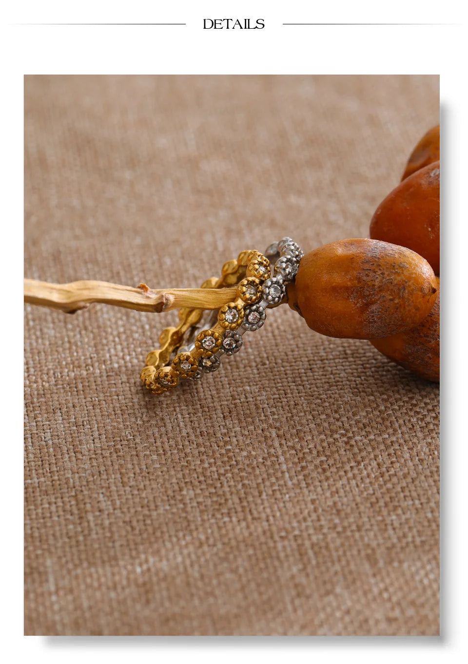 Cubic zirconia flower geometric ring in 18K gold-plated stainless steel with cubic zirconia.