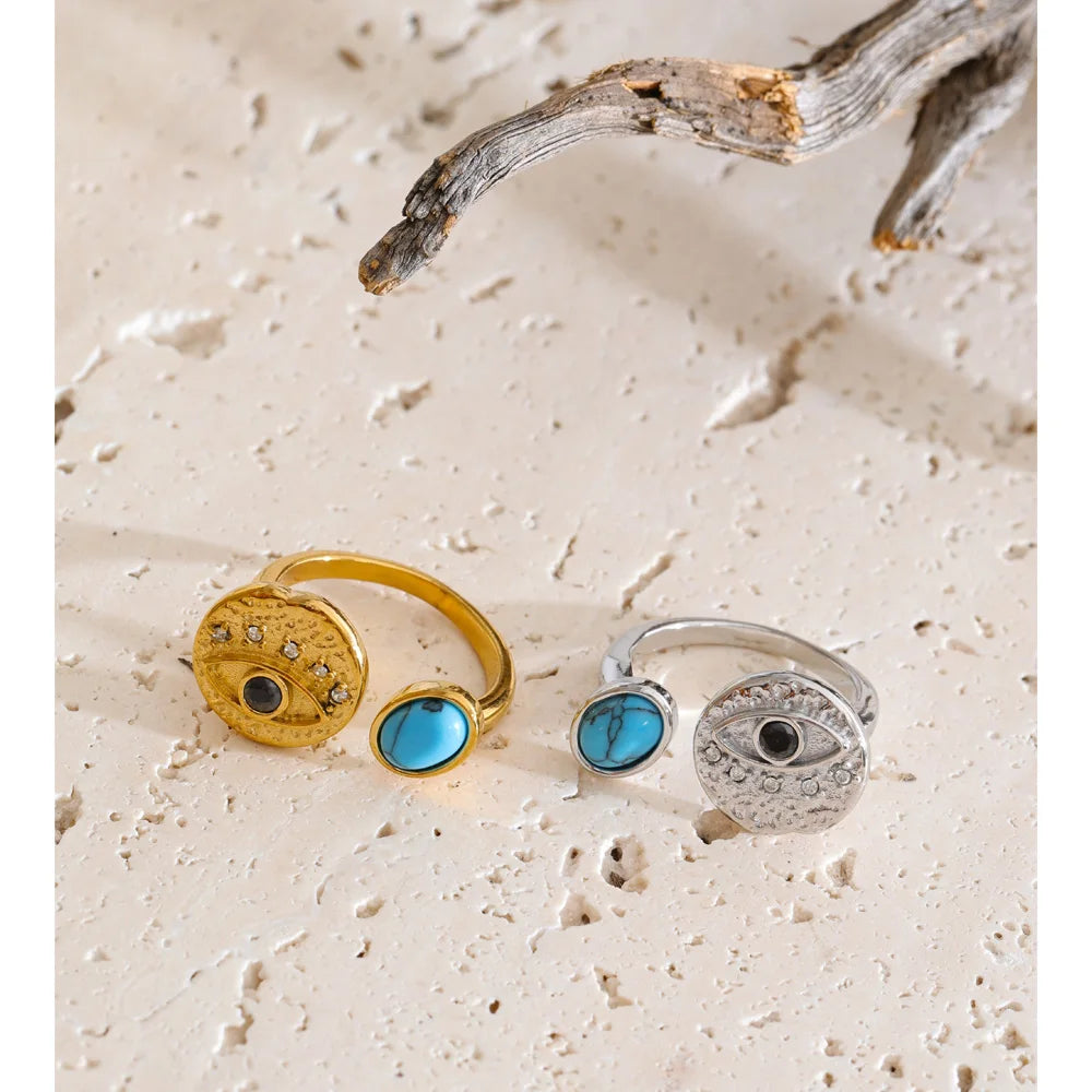 Cubic zirconia natural stone geometric ring in 18K gold-plated stainless steel with cubic zirconia and natural stone.