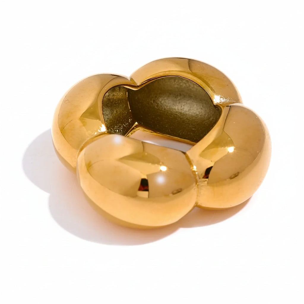 Gold-plated ring with a unique three-leaf design.