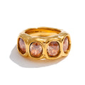 Cubic zirconia geometric ring in 18K gold-plated stainless steel with cubic zirconia.