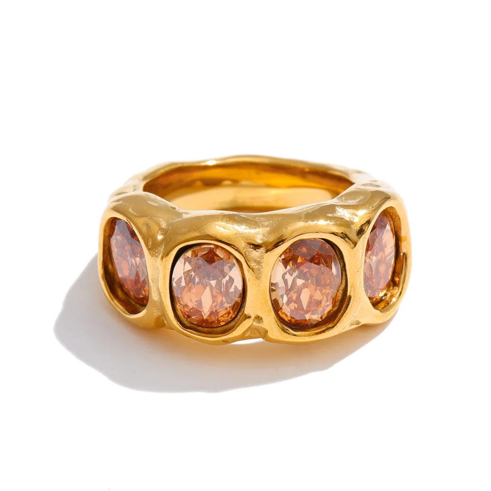 Cubic zirconia geometric ring in 18K gold-plated stainless steel with cubic zirconia.