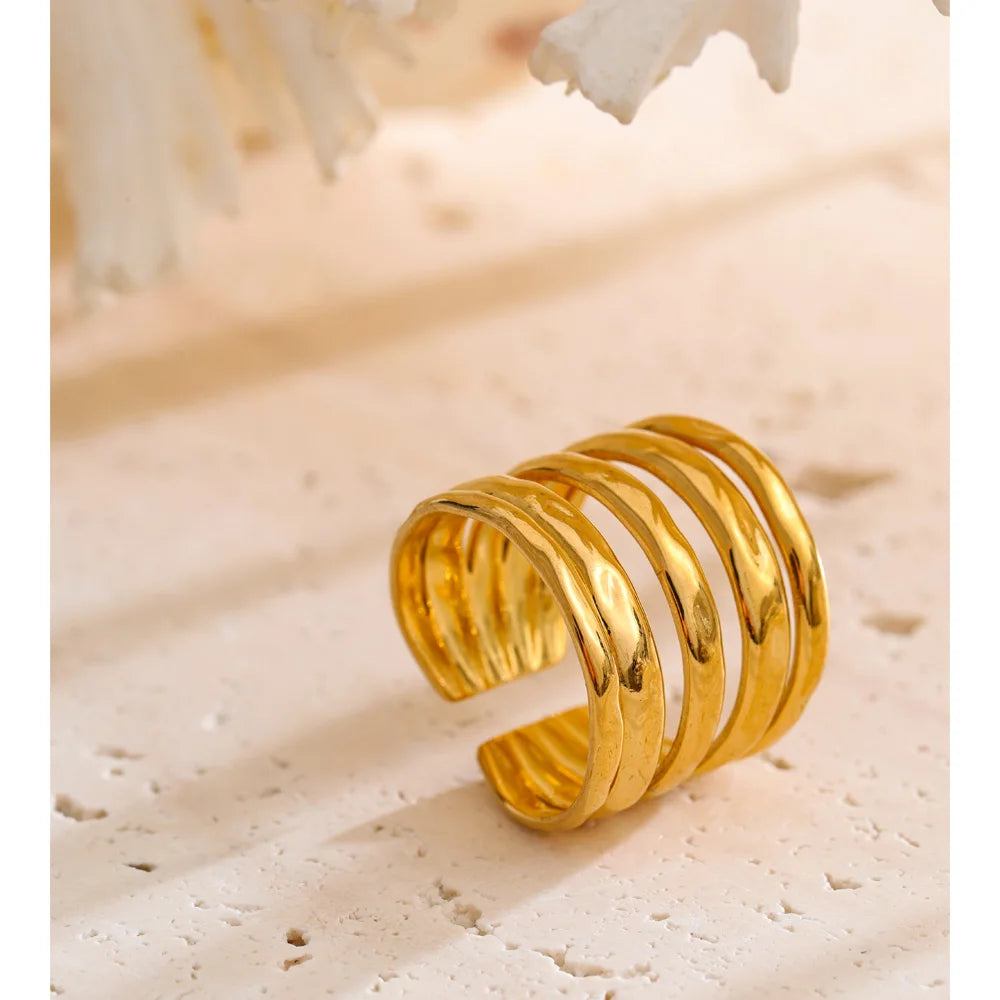 Geometric layered ring in 18K gold-plated stainless steel.