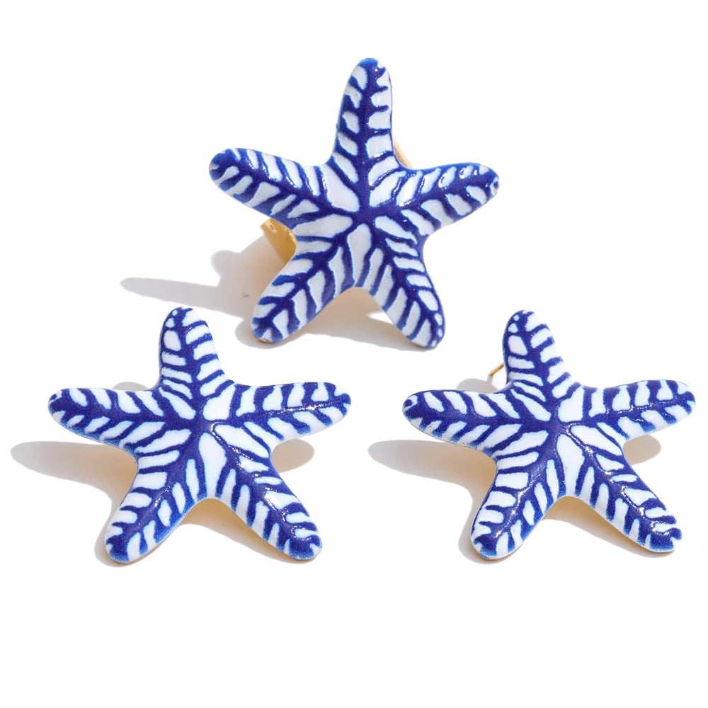 Blue star geometric earrings in gold-plated stainless steel.