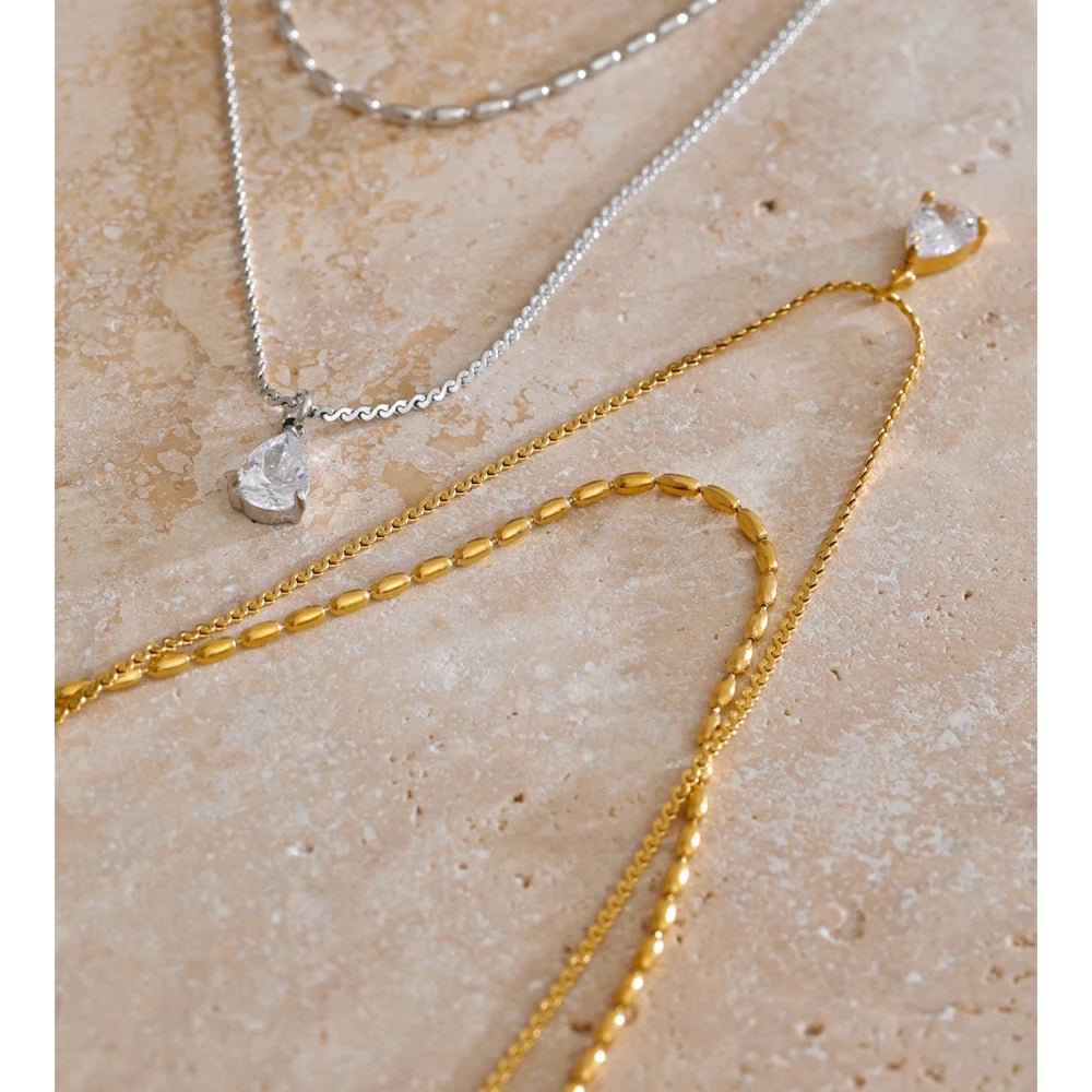 Cubic zirconia geometric layered necklace in gold-plated stainless steel with cubic zirconia.