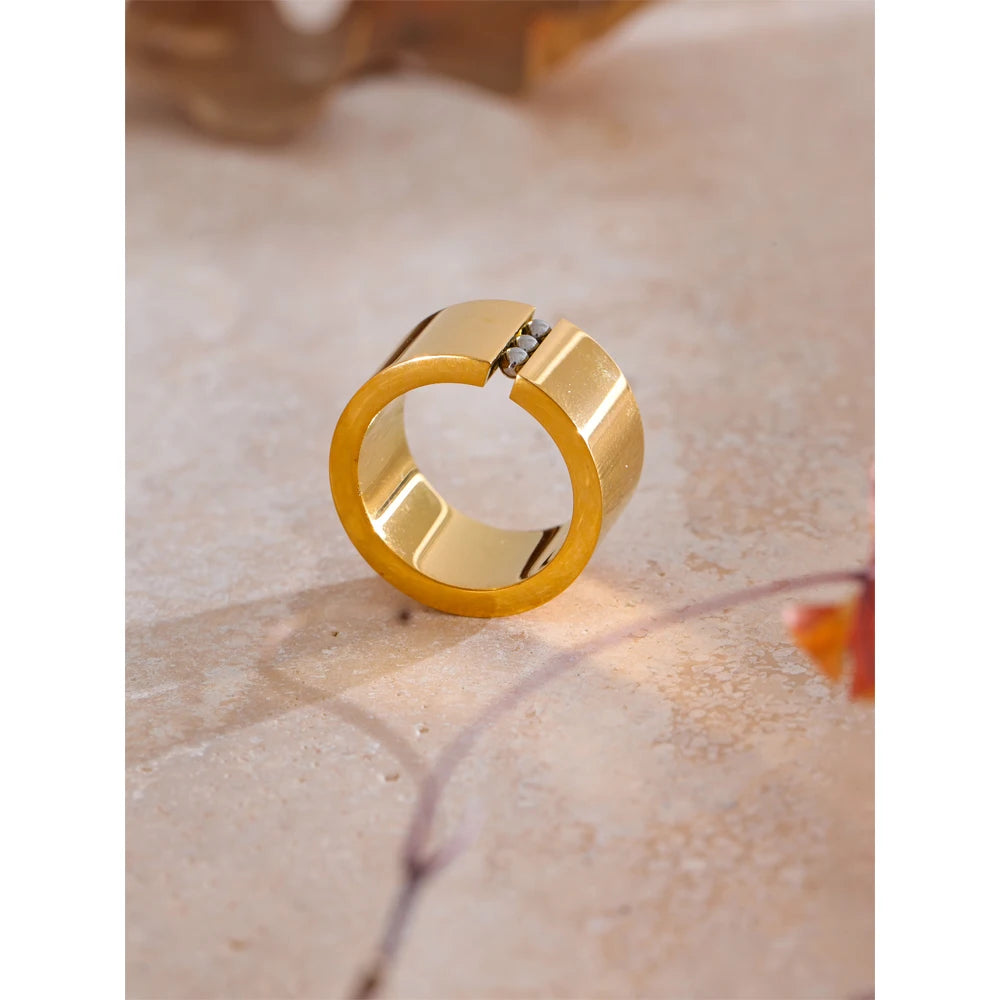 Geometric ring in gold-plated stainless steel.