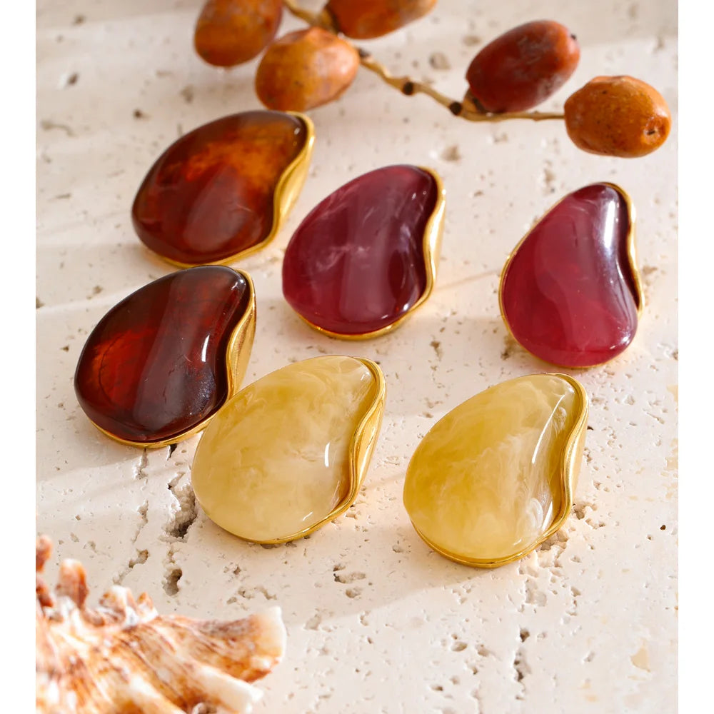 Red resin acrylic earrings in gold-plated stainless steel with resin and acrylic.