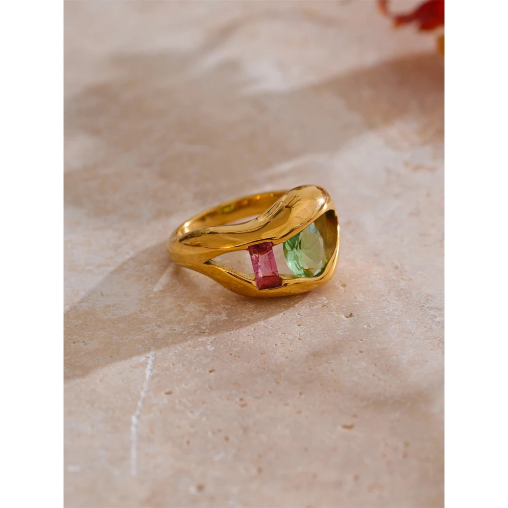 Cubic zirconia geometric ring in 18K gold-plated stainless steel with cubic zirconia.