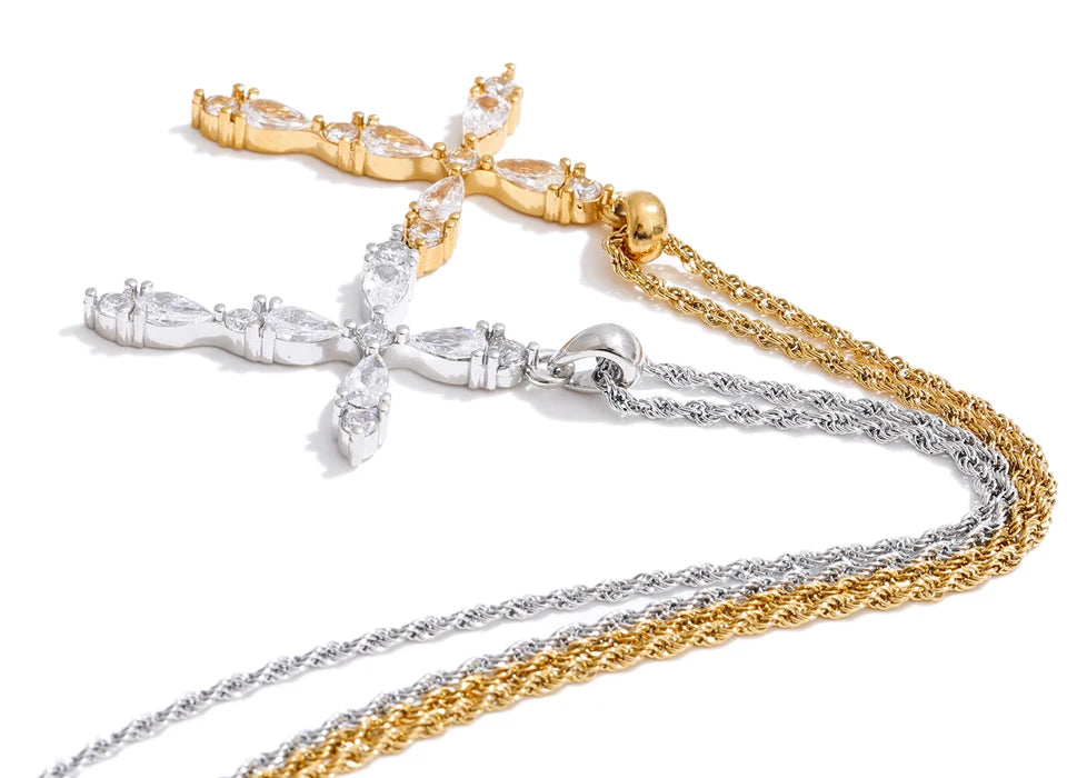 Cubic zirconia cross necklace in gold-plated stainless steel with cubic zirconia.