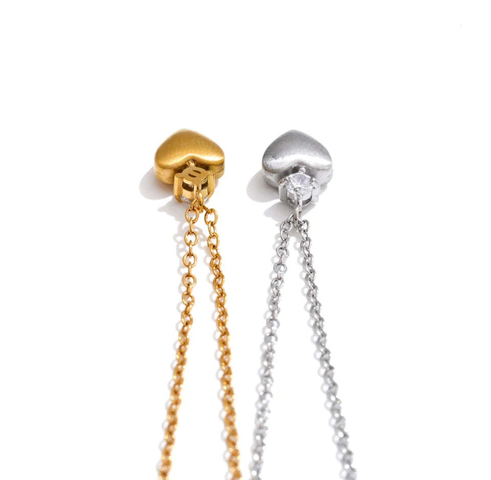 Cubic zirconia heart necklace in gold-plated stainless steel with cubic zirconia.