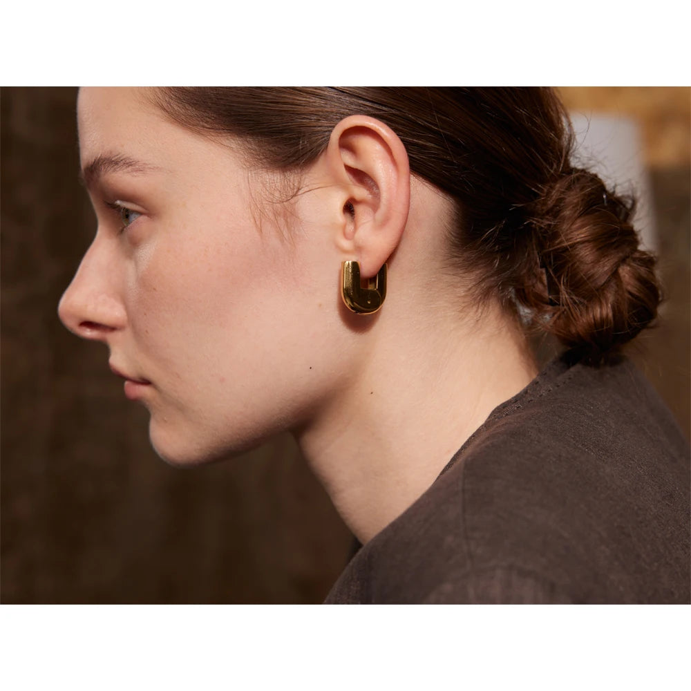Geometric earrings in gold-plated 316L stainless steel.